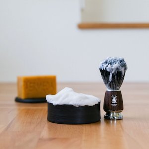 Milk shaving soap in a minimalist ceramic vessel