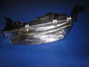 Motor vehicle part dealing - used: 1995 Ford Fairmont Left Headlamp