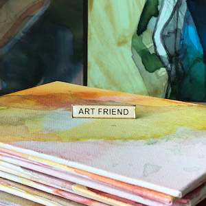 Badges: “ART FRIEND” pin