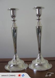 A Set Of Two Single Silver Candle Holders