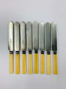 Set of 8 bone handled lunch knives with sterling silver cuffs