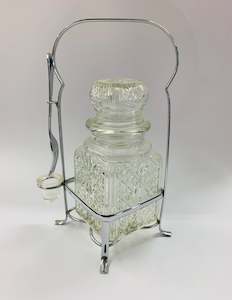 Vintage glass olive jar with fork