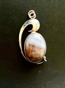 Sterling Silver Pendant with an Oval Brown and White Stone with Wave Design