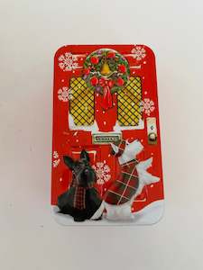 Rectangular Scottie Dog Tin in-front of a Christmas Door