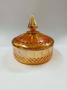 Orange carnival glass lidded bowl