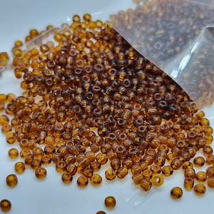 Womenswear: 15g 2mm Brown Transparent Seed Beads