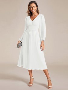 Clothing: Tari knee length long sleeve wedding dress in ivory