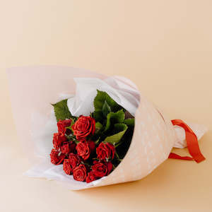 1 Dozen Red Roses in Blush Wrap