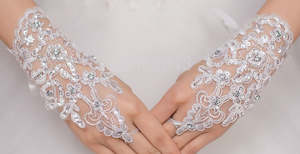 BBGV2. Lace wrist length finger-less glove. Embellished with pearls and sequins.