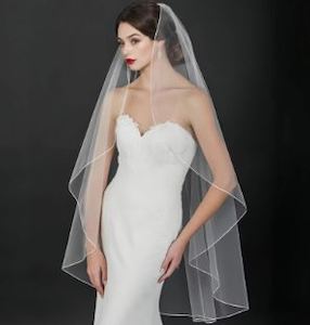 Womenswear: BBV80 single layer fingertip veil with pencil edge.