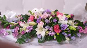 Casket Spray flower arrangement in pink, lavender and white