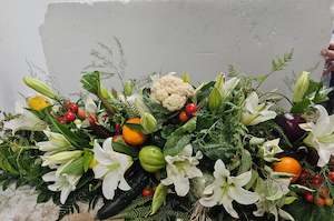 Flower arrangement Casket Spray, white flowers and vegetables