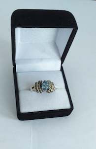 Florist: Ring, Blue Topaz and Marcasite Bridge Style Sterling Silver