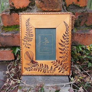 Piwakawaka and Fern Frame