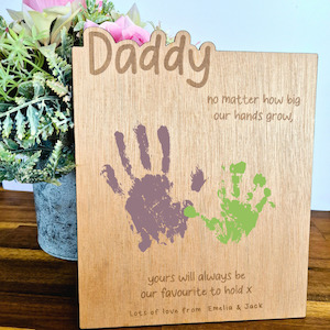 "No matter how big our hands grow" handprint plaque