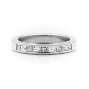 Jewellery: Princess and baguette cut diamond platinum wedding ring