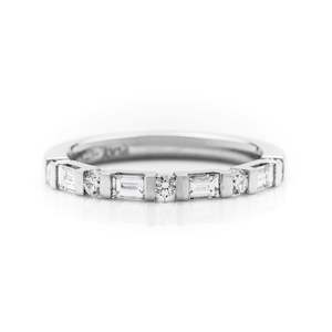 Jewellery: Platinum tab set Bagguette and round diamond wedding ring