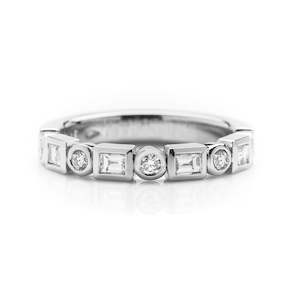 Baguette and round diamond rub set platinum wedding ring