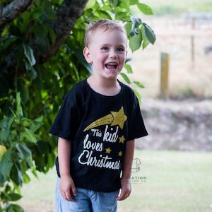 Christmas: This Kid Loves Christmas tee (childrens)