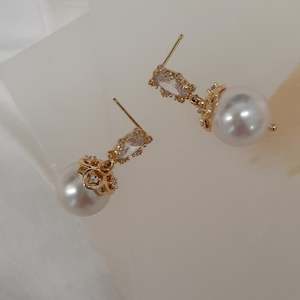 Calista - cubic zirconia stud and embellished pearl drop earrings