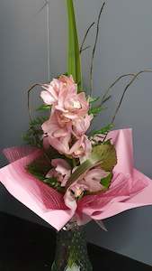 Florist: Gift wrapped single stem of Cymbidium Orchid