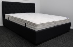 Bed: Queen black upholstered bed &. Pillow top mattress