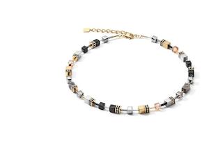 COEUR DE LION NECKLACE, GOLD PLATED ST/ST GEO-CUBE IN BLACK/GOLD & TITANIUM OXID…