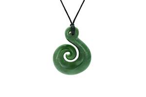 NZ greenstone koru 45x25mm carved by bill Goodwin