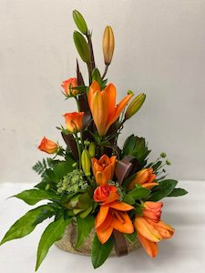 Florist: Flax Bag Arrangement.