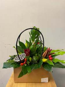 Florist: Beautiful hand bag Arrangement.