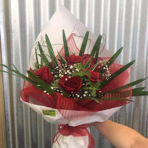 Six red rose bouquet.