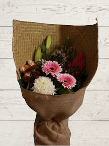 Florist: Harakeke wrap pastel bouquet