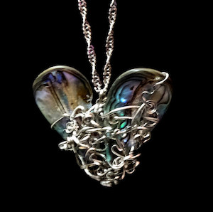 Graphic design service - for advertising: Paua shell pendant-heart Fossil Studios