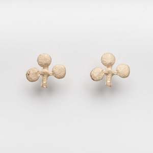 Pure gold club studs by Hannah Upritchard