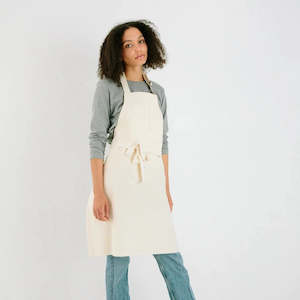 Cream denim apron made by M.N Uniform in Northland, Aotearoa