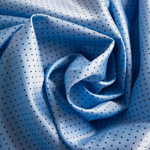 Textile wholesaling: BLUE BLACK SPOT LINING