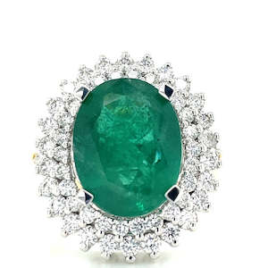 Watch: 18k B/Tne 6.65ct Oval Emerald & 1.24ct Diamonds Cluster Ring