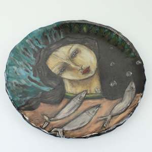 Woman with fish plate