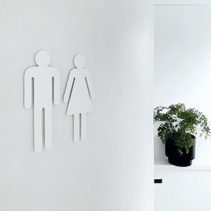 Matte white steel toilet symbols