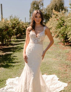 Products: Savina ML24222 Madison Rose Bridal fitnflare silhouette is adorned with floral lace and sequin motifs. Cascading lace on the dramatic unlined train makes a captivating statement