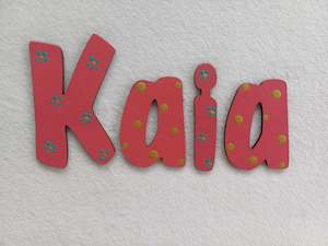 Kaia - small letters suitable for a door.