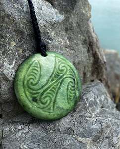 Carved porowhita Pendant