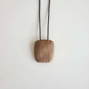 Pillow pendant - petrified wood