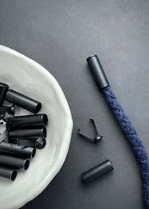 Dressmaking supply: Black Metal Cord End