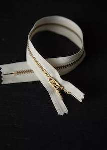 Dressmaking supply: 30cm.  YKK Brass Closed End Zip. Ecru