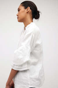 Womenswear: ruffed shirt / white linen