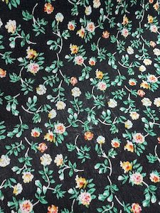 RD2 – 100% Rayon – Black with a cluster of flowers – 148cm wide – per mtr