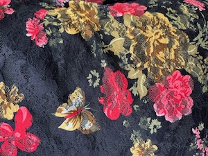 Products: Stretch patterned Lace – L12 – Colourful Gold and Red Flowers on Black Lace and Butterflies – Polyester Spandex – 145cm wide – per mtr