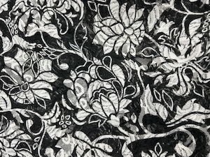 Products: Stretch Patterned Lace – L18 – White Large Flowers on a Black Lace Background – Polyester Spandex – 145cm wide – per mtr