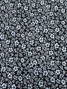 100% Dress Cotton – Tiny flowers of white on Black – 100% Cotton – 1.15cm wide – pm